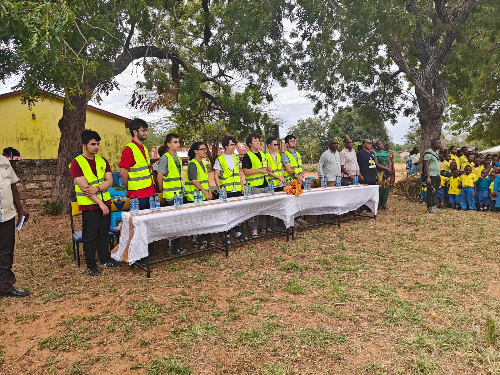 Volunteers joining hands together